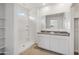 Bathroom boasts double vanity with granite countertop and shower at 40080 W Venture Rd, Maricopa, AZ 85138