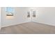 Bright bedroom with carpet flooring and window with blinds at 40080 W Venture Rd, Maricopa, AZ 85138