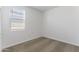 Well-lit bedroom featuring carpet and window with blinds at 40080 W Venture Rd, Maricopa, AZ 85138