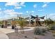 Modern playground with shade structures and ample seating at 40080 W Venture Rd, Maricopa, AZ 85138