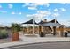 Community playground with shade structures and picnic tables at 40080 W Venture Rd, Maricopa, AZ 85138