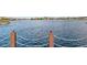 Serene lake view with a chain link fence at 40080 W Venture Rd, Maricopa, AZ 85138