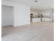 Spacious living room with tile floors and an open concept design at 40080 W Venture Rd, Maricopa, AZ 85138