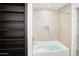 Bathroom with soaking tub and shelving at 7120 E Kierland Blvd # 520, Scottsdale, AZ 85254