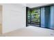 Bedroom with large windows and balcony access at 7120 E Kierland Blvd # 520, Scottsdale, AZ 85254
