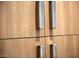 Wood kitchen cabinets with silver handles at 7120 E Kierland Blvd # 520, Scottsdale, AZ 85254