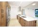 Modern kitchen with stainless steel appliances and wood cabinetry at 7120 E Kierland Blvd # 520, Scottsdale, AZ 85254