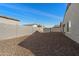 Private backyard with gravel landscaping and block wall at 738 W Jardin Dr, Casa Grande, AZ 85122