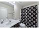 Clean bathroom with single sink vanity and shower/tub combo at 738 W Jardin Dr, Casa Grande, AZ 85122