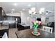 Kitchen with island and view of living room and breakfast area at 738 W Jardin Dr, Casa Grande, AZ 85122