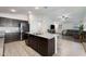 Open concept kitchen with island and living room view at 738 W Jardin Dr, Casa Grande, AZ 85122