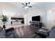 Open living area with fireplace and kitchen view at 738 W Jardin Dr, Casa Grande, AZ 85122
