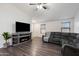 Living room with sectional sofa and electric fireplace at 738 W Jardin Dr, Casa Grande, AZ 85122