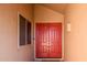 Red double door entry with sidelight and welcome mat at 9849 E Amenity Dr, Sun Lakes, AZ 85248