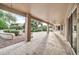 Covered patio with ceiling fans and tile flooring at 14825 W Devlin Dr, Goodyear, AZ 85395