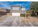 Two-story house with a two-car garage and landscaped front yard at 14850 W Laurel Ln, Surprise, AZ 85379