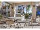 Outdoor BBQ area with table, chairs, and built-in grills at 15095 N Thompson Peak Pkwy # 2082, Scottsdale, AZ 85260