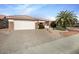 Single-story home with two-car garage and desert landscaping at 15744 W Clear Canyon Dr, Surprise, AZ 85374