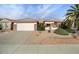 Single-story home with two-car garage and desert landscaping at 15744 W Clear Canyon Dr, Surprise, AZ 85374