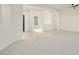 Open living room with neutral color palette and tile flooring at 15744 W Clear Canyon Dr, Surprise, AZ 85374