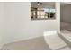 Living room with view to backyard through a window at 15744 W Clear Canyon Dr, Surprise, AZ 85374