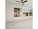 Bright living room featuring large windows and carpet at 15744 W Clear Canyon Dr, Surprise, AZ 85374