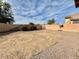 Large backyard with gravel and dirt. Good for pets and play at 16722 N 173Rd Ave, Surprise, AZ 85388