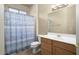 Clean bathroom with shower/tub combo and updated vanity at 17346 W Alder Ln, Surprise, AZ 85387