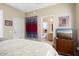 Main bedroom with ensuite bathroom and a TV at 17346 W Alder Ln, Surprise, AZ 85387