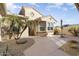 Front courtyard entry with tile flooring and desert plants at 17346 W Alder Ln, Surprise, AZ 85387