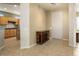 Bright entryway with view into kitchen and tile flooring at 17346 W Alder Ln, Surprise, AZ 85387
