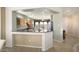 Kitchen with breakfast bar and view to the Gathering room at 17346 W Alder Ln, Surprise, AZ 85387