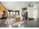 Modern kitchen with island, stainless steel appliances, and breakfast nook at 17346 W Alder Ln, Surprise, AZ 85387