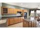 Large kitchen with island, ample cabinetry, and stainless steel appliances at 17346 W Alder Ln, Surprise, AZ 85387