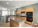 Island kitchen with stainless steel appliances and plenty of counter space at 17346 W Alder Ln, Surprise, AZ 85387