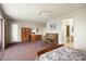 Main bedroom with a large window, walk-in closet, and ensuite bathroom at 17346 W Alder Ln, Surprise, AZ 85387