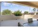 Covered patio with seating area and desert views at 17346 W Alder Ln, Surprise, AZ 85387
