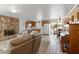 Open floorplan living room with kitchen and stone fireplace at 17416 E Oro Grande Dr, Fountain Hills, AZ 85268