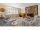 Living room featuring a stone fireplace and comfortable seating at 17416 E Oro Grande Dr, Fountain Hills, AZ 85268