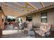 Relaxing patio with covered seating area, ceiling fan, and tile flooring at 26609 S Howard Dr, Sun Lakes, AZ 85248