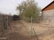 Chain link fence encloses a sandy area at 30138 W Roosevelt St, Buckeye, AZ 85396