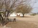 Backyard view with two chairs and a small table at 30138 W Roosevelt St, Buckeye, AZ 85396