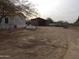 Property with a mobile home, detached garage, and large yard at 30138 W Roosevelt St, Buckeye, AZ 85396