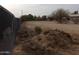 Expansive lot with chain link fence and desert landscape at 30138 W Roosevelt St, Buckeye, AZ 85396