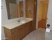Bathroom features a vanity with storage and a view to another room at 30138 W Roosevelt St, Buckeye, AZ 85396