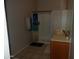 Clean bathroom with shower/tub combo, double vanity, and tiled floors at 30138 W Roosevelt St, Buckeye, AZ 85396