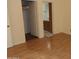 Bedroom with wood-look floors and en-suite bathroom at 30138 W Roosevelt St, Buckeye, AZ 85396
