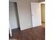 Simple bedroom with laminate wood flooring at 30138 W Roosevelt St, Buckeye, AZ 85396