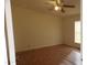 Spacious bedroom featuring laminate floors and a ceiling fan at 30138 W Roosevelt St, Buckeye, AZ 85396