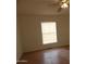 Bright bedroom with wood floors and a ceiling fan at 30138 W Roosevelt St, Buckeye, AZ 85396